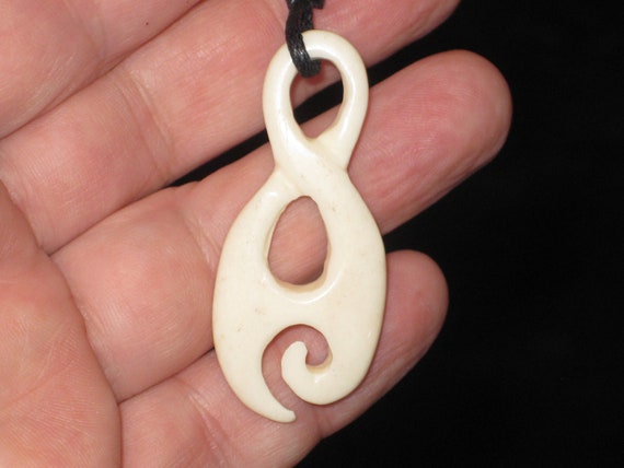 Buffalo bone Maori warrior tribal hand carved pendant.