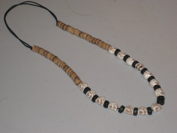 Howlite skulls, & heishi wood bead necklace, adjustable and hand made.