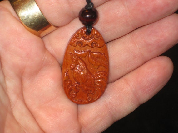 Hand carved Rosewood rooster pendant necklace.