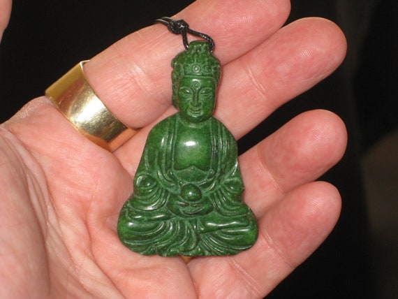 All natural hand carved Buddha pendant, with adjustable necklace.