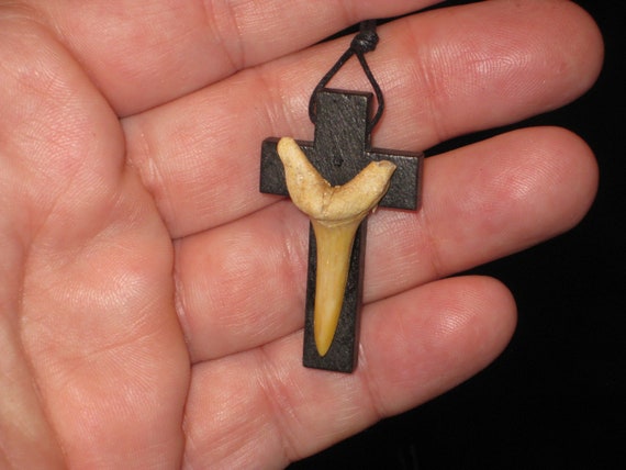 Hand carved wood cross and fossil shark tooth from Morocco, with adjustable necklace.