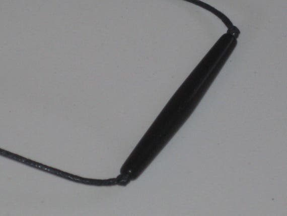 Hand carved bone tube pendant, with adjustable necklace.