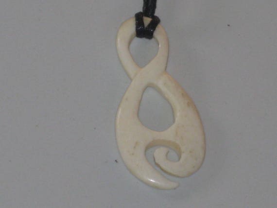 Hand carved bone pendant, with adjustable necklace.