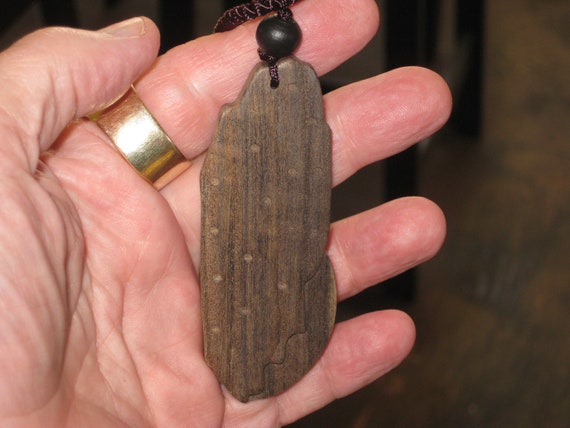Hand carved Sandalwood pendant, with adjustable necklace.