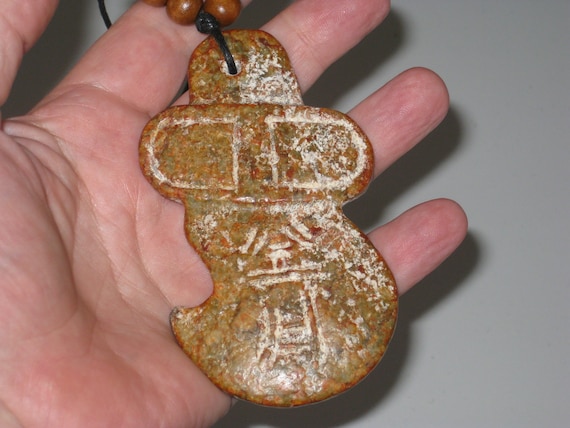 Primitive hand carved old jade stone amulet pendant, necklace is adjustable up to 32" long.