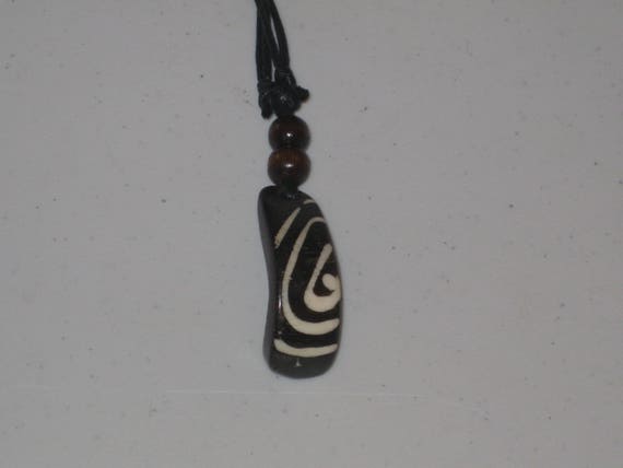 Hand carved primitive African design pendant, Buffalo bone.