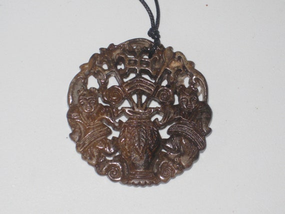 All natural hand carved two sided Jade man and woman pendant, with adjustable necklace.