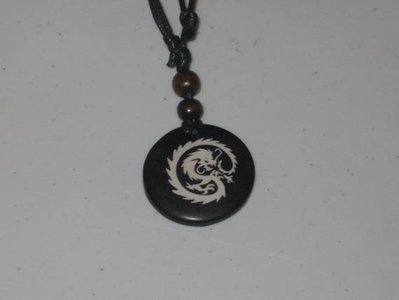 Ox bone dragon pendant with adjustable necklace.