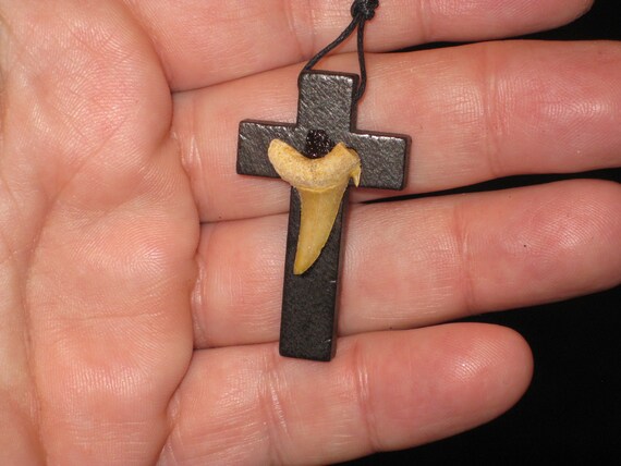 Hand carved wood cross and fossil shark tooth from Morocco, with adjustable necklace.