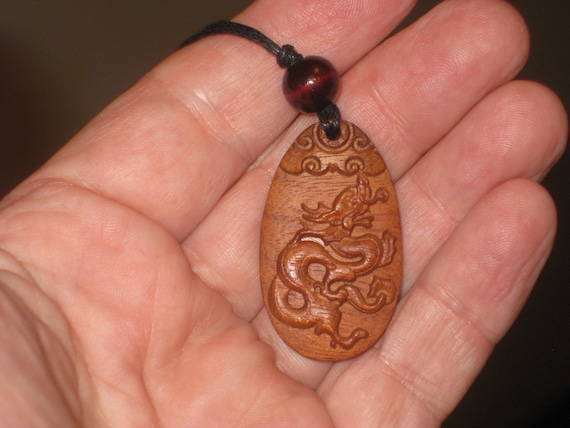 Hand carved Chinese Zodiac sign rosewood necklace (Dragon), 24" long.