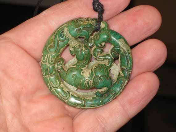 Hand carved Jade dragon and tiger pendant, with adjustable necklace.