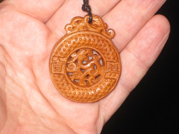 Hand carved rosewood pendant, adjustable necklace.