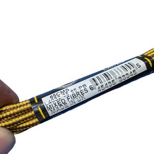 May include: A pair of yellow and brown mixed fiber shoelaces, 65 cm long, are held against a white background. The label reads "Mixed Fibres" and "Made in UK".