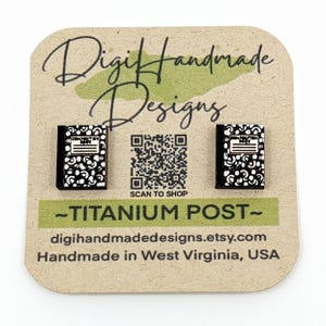 May include: A pair of black and white notebook earrings with titanium posts. The earrings are handmade in West Virginia, USA.  -TITANIUM POST- digihandmadedesigns.etsy.com