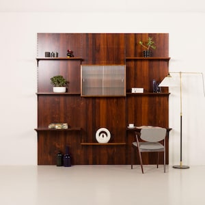 Poul Cadovius rosewood wall unit on panels for Cado, Denmark 1960s