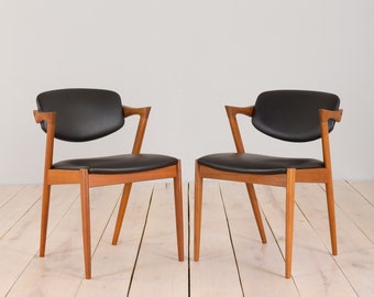 Pair of teak Kai Kristiansen chairs model 42 in black leather, 1960s