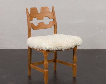 Oak Razor Blade chair in natural sheepskin by Henning Kjaernulf