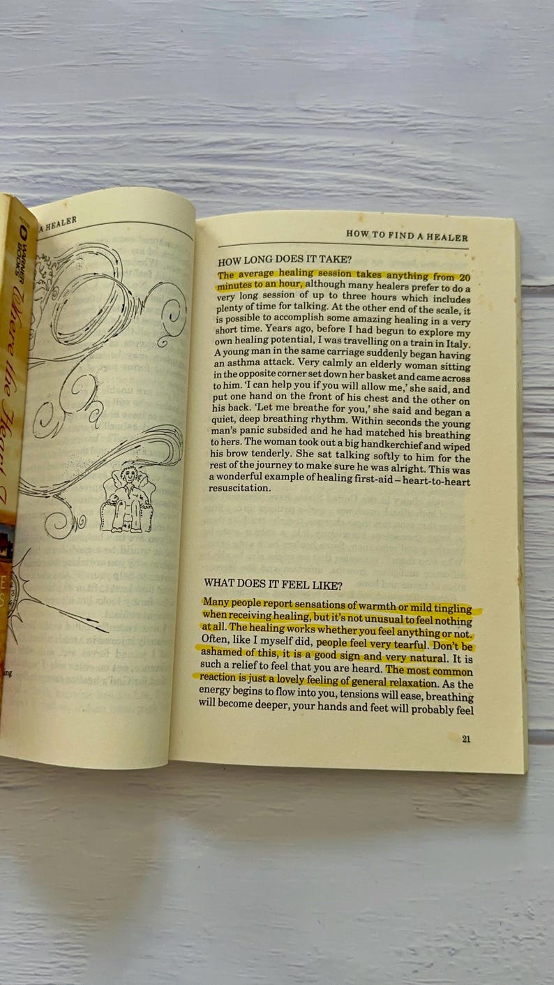 May include: Open book with text about healing sessions, including how long they take and what they feel like. The pages are yellowed, and the text is in black. A small illustration is visible.