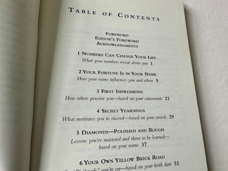 May include: Table of Contents page from a book titled "Numbers Can Change Your Life". The book explores the influence of numbers, names, and birth dates on a person's life. Chapters include "Your Fortune is in Your Name", "First Impressions", "Secret Yearnings", "Diamonds - Polished and Rough", and "Your Own Yellow Brick Road".