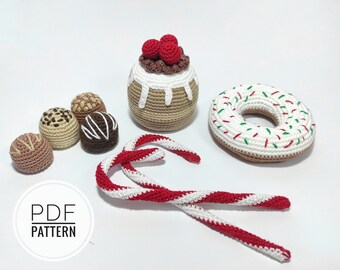 May include: Crochet amigurumi pattern for a set of Christmas treats including a candy cane, a donut, a chocolate, and a cake with red berries on top. The pattern is available as a PDF download.