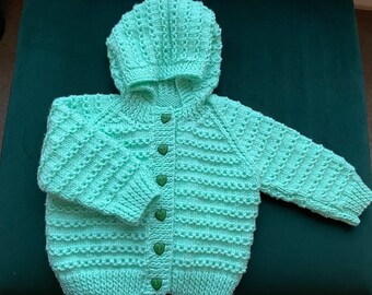 A Cosy Knitted Jacket With Hood