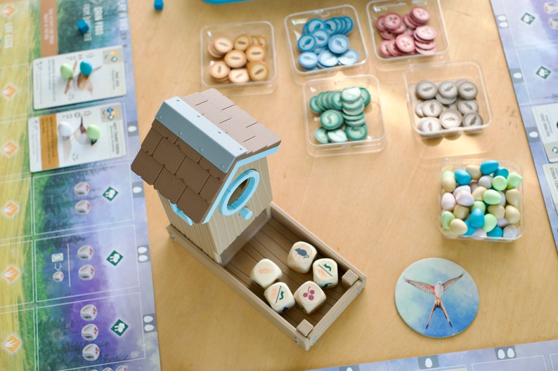 Overhead view of 3D printed dice tower being used in the board game Wingspan.