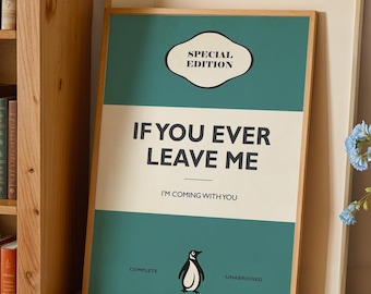 May include: A rectangular framed print featuring a teal and cream color scheme with the text SPECIAL EDITION, IF YOU EVER LEAVE ME, I'M COMING WITH YOU, and a small penguin illustration. The print is displayed in a light wood frame on a shelf.