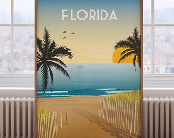 May include: A vintage-style poster with the word "FLORIDA" in bold black letters at the top. The poster depicts a beach scene with palm trees, a setting sun, and a sailboat in the distance. The beach is sandy and there are wooden fences on either side of the path leading to the water.