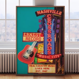 May include: A framed poster featuring a red guitar and neon signs that read "Nashville Crossroads" and "Music City." The poster also includes the text "Ernest Record" and "Real Country Music Lives Here, Est. 1947."