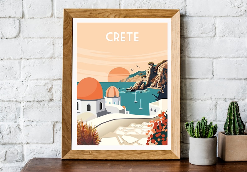 May include: A framed illustration of a sunset over a coastal town in Crete, Greece. The illustration features white buildings with orange domed roofs, a blue sea, and a rocky cliff in the background. The text "CRETE" is printed in white at the top of the illustration.