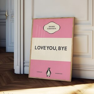 May include: A pink and white poster with a penguin illustration and the text "LOVE YOU, BYE" in black. The poster has a title that reads "HOME EDITION" and the words "COMPLETE" and "UNABRIDGED" at the bottom.
