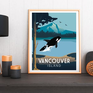 May include: A framed poster with a blue, green, and white illustration of a killer whale jumping out of the water. The poster has the text "Vancouver Island" at the bottom.