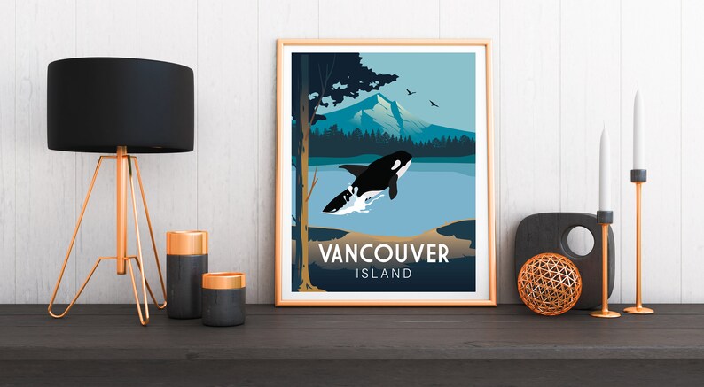 May include: A framed poster with a blue, green, and white illustration of a killer whale jumping out of the water. The poster has the text "Vancouver Island" at the bottom.