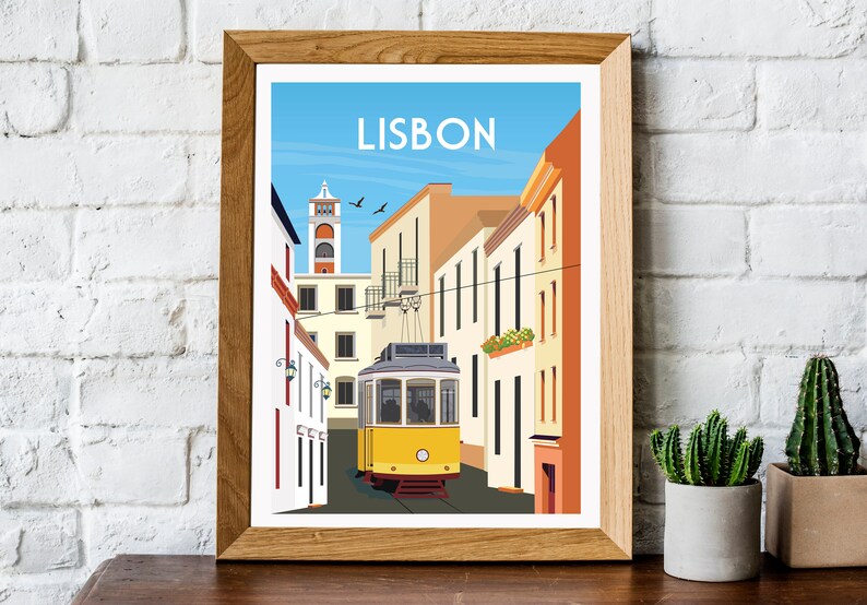 May include: A yellow tram travels down a narrow street in Lisbon, Portugal. The street is lined with colorful buildings and the tram is surrounded by a blue sky.