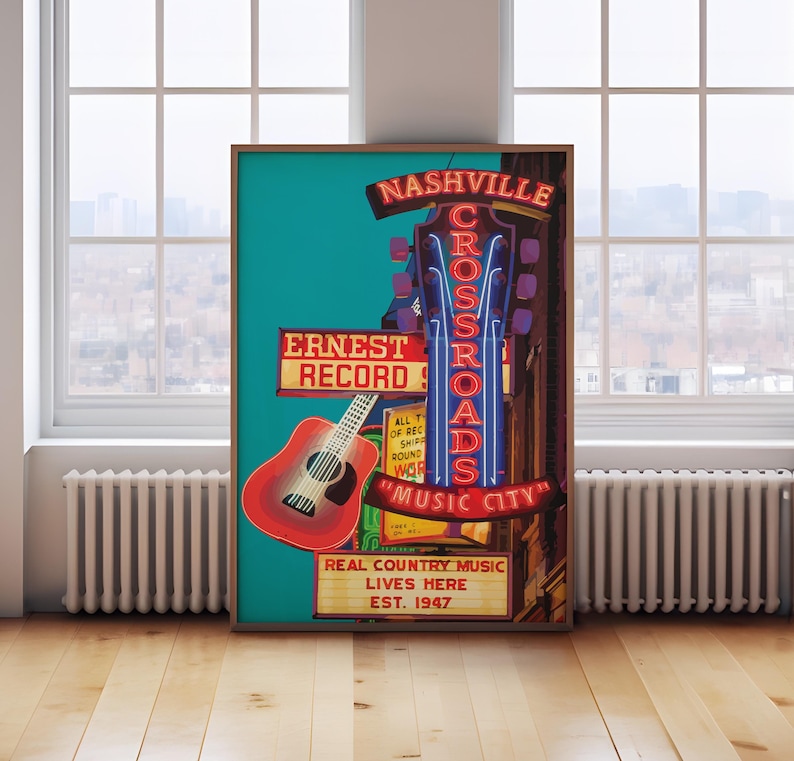 May include: A framed poster featuring a red guitar and neon signs that read "Nashville Crossroads" and "Music City." The poster also includes the text "Ernest Record" and "Real Country Music Lives Here, Est. 1947."