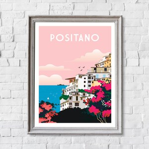 May include: A colorful illustration of Positano, Italy, with a pink sky, white buildings, and a blue sea. The text "Positano" is written in white letters on a pink background.