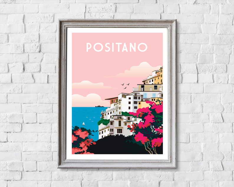 May include: A colorful illustration of Positano, Italy, with a pink sky, white buildings, and a blue sea. The text "Positano" is written in white letters on a pink background.