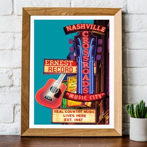 May include: A framed print featuring a vibrant illustration of a Nashville music scene. The artwork showcases a red guitar, neon signs reading "Nashville Crossroads Music City," and "Ernest Record," with the text "Real Country Music Lives Here Est. 1947."