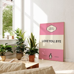 May include: A pink and white poster with the text "HOME EDITION" and "LOVE YOU, BYE" in black. A penguin illustration is at the bottom with the words "COMPLETE" and "UNABRIDGED".