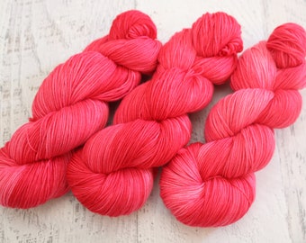 Red Tonal Fingering Weight Sock Yarn (75/25 Superwash Merino/ Nylon) hand dyed in pinkish red tones - 100 g