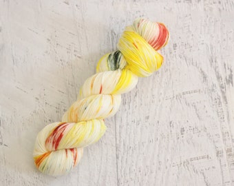 Yarn Mop Variegated Fingering Weight Sock Yarn (75/25 Superwash Merino/ Nylon) Hand Dyed inYellow with pops of orange and green - 100 g