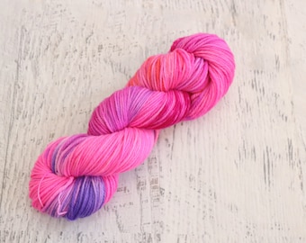 Bright Pink Variegated DK Weight Yarn (100% Superwash Merino) Hand Dyed in Neon Pink with hints of orange and purple - 100 g