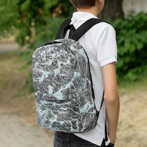 Schoolrugzak van gebroken glas, volledig bedrukt, met laptopvak aan de binnenkant en verborgen achterzak