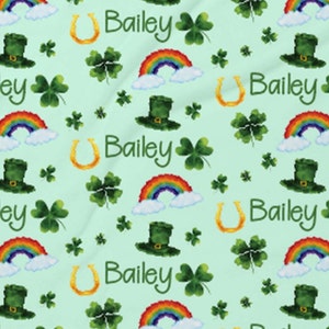 May include: A green background with a repeating pattern of rainbows, shamrocks, horseshoes, leprechaun hats, and the name Bailey.