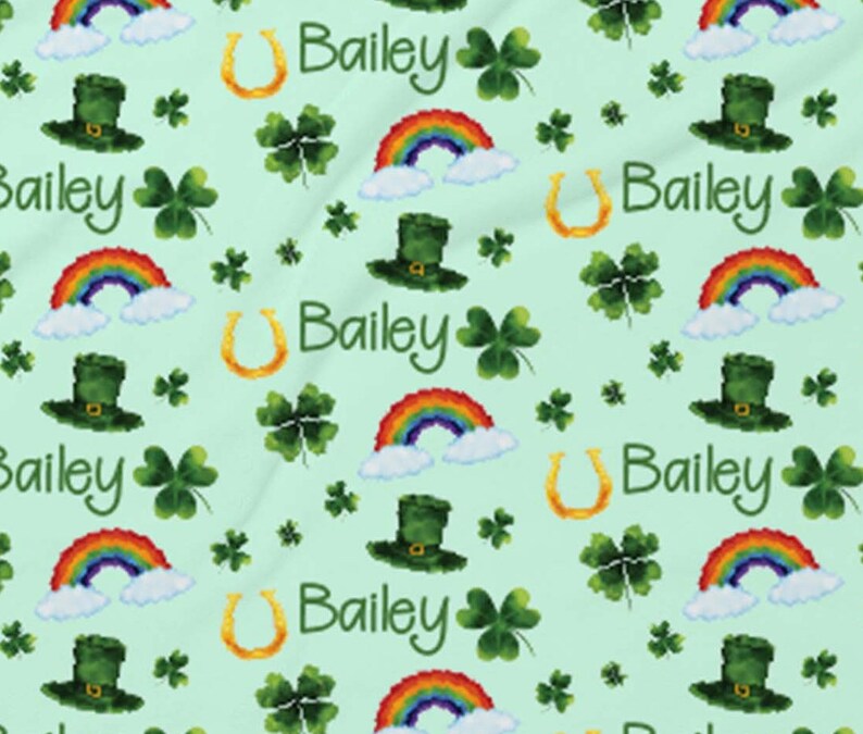 May include: A green background with a repeating pattern of rainbows, shamrocks, horseshoes, leprechaun hats, and the name Bailey.