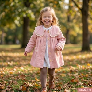May include: A dusty pink corduroy coat featuring a wide collar with cream lace trim, long sleeves with lace-trimmed cuffs, two front pockets with lace detailing, and a row of light-colored buttons down the center, worn over a white dress and brown tights.