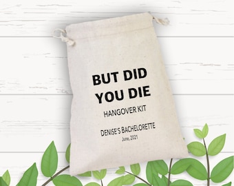 May include: A white canvas bag with a black drawstring. The bag has the text "But Did You Die" printed on it, followed by "Hangover Kit", "Denise's Bachelorette", and "June, 2021".