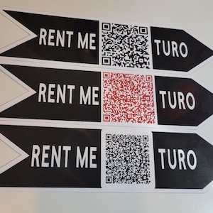 May include: Three black and white arrow-shaped signs with the text "RENT ME" and "TURO" on each sign. Each sign also features a black and white QR code.