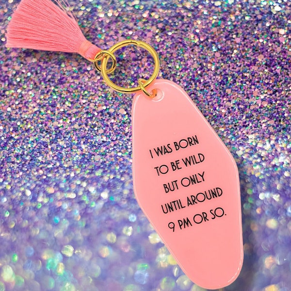 I was born to be wild but only until around 9pm or so - retro motel style plastic keychain - pink with tassel