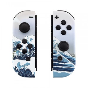 May include: A pair of white Nintendo Switch Joy-Con controllers with a blue and white wave design. The controllers feature the standard buttons and a black analog stick.